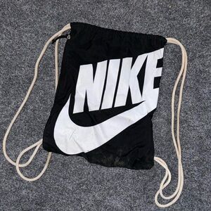 Nike Black Drawstring Backpack with White Swoosh and Logo